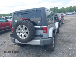 2014 Jeep Wrangler Unlimited Sahara z VIN 1C4BJWEG0EL129229, wystawiony jako IAAI lot #42380976 z przebiegiem 175 735 mil mil oraz . Historia ofert i sprzedaży dostępna na DreamBid. Obrazek 16.