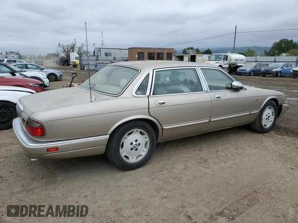 1997 Jaguar XJ Vanden Plas with VIN SAJKX6245VC800386, listed as a Copart auction lot 53651675 with 158,185 mi miles and Salvage Title. Bid and sale history available at DreamBid. Image 3.