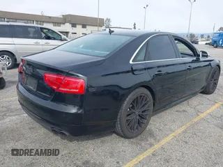 2013 Audi S8 with VIN WAUD2AFD0DN028673, listed as a IAAI auction lot 41689320 with 115,502 mi miles. Bid and sale history available at carsss.com. Image 4.