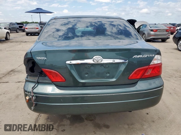 2003 Toyota Avalon XL z VIN 4T1BF28BX3U310285, wystawiony jako Copart lot #57664375 z przebiegiem 179 727 mil mil oraz Szkoda całkowita • Salvage title. Historia ofert i sprzedaży dostępna na DreamBid. Obrazek 6.
