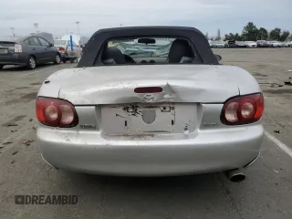 2004 Mazda MX-5 Miata LS with VIN JM1NB353440402453, listed as a Copart auction lot 45064475 with 151,508 mi miles and Salvage title. Bid and sale history available at DreamBid. Image 6.