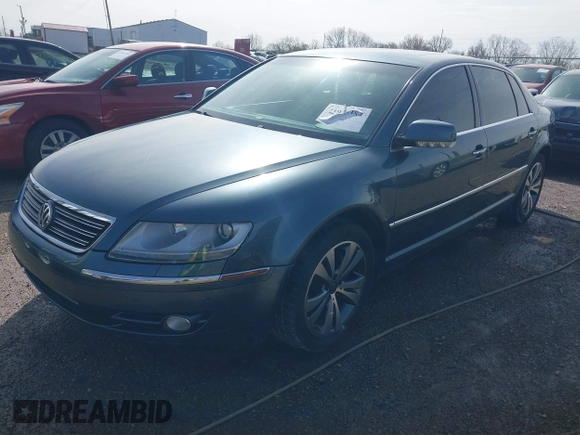 2006 Volkswagen Phaeton z VIN WVWAF03D168000214, wystawiony jako IAAI lot #41935384 z przebiegiem 80 641 mil mil oraz . Historia ofert i sprzedaży dostępna na DreamBid. Obrazek 2.