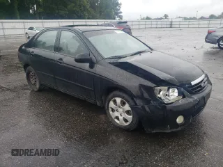 2005 Kia Spectra LX with VIN KNAFE121055134568, listed as a Copart auction lot 71541244 with 146,751 mi miles and Salvage Title. Bid and sale history available at carsss.com. Image 4.