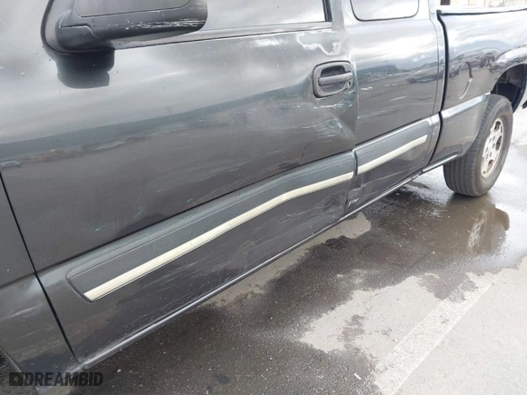 2003 Chevrolet Silverado 1500 LS with VIN 1GCEK19TX3E107860, listed as a IAAI auction lot 41461401 with 379,055 mi miles. Bid and sale history available at carsss.com. Image 6.
