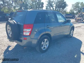2006 Suzuki Grand Vitara Premium with VIN JS3TD943064100693, listed as a IAAI auction lot 41772479 with 135,901 mi miles. Bid and sale history available at carsss.com. Image 4.