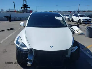 2023 Tesla Model Y Long Range with VIN 7SAYGDEEXPA129790, listed as a IAAI auction lot 41735721 with 20,402 mi miles and . Bid and sale history available at DreamBid. Image 13.