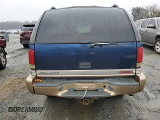 1999 GMC Jimmy SLE with VIN 1GKDT13W8X2545509, listed as a Copart auction lot 81608944 with 130,881 mi miles and Salvage Title. Bid and sale history available at carsss.com. Image 6.