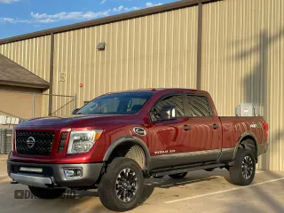 2016 Nissan Titan XD PRO-4X with VIN 1N6BA1F40GN516889, listed as a Copart auction lot 81415354 with 124,664 mi miles and Clean Title. Bid and sale history available at carsss.com. Image 2.