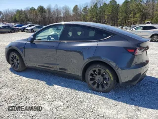 2025 Tesla Model Y Long Range with VIN 7SAYGAEEXSF253326, listed as a Copart auction lot 49527965 with 5,803 mi miles and Salvage Title. Bid and sale history available at DreamBid. Image 2.