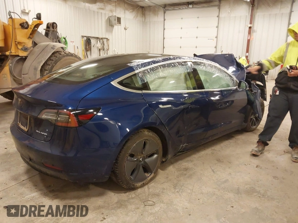 2018 Tesla Model 3 Long Range Battery with VIN 5YJ3E1EB7JF086201, listed as a IAAI auction lot 41965193 with 99,231 mi miles and . Bid and sale history available at DreamBid. Image 4.