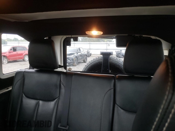 2018 Jeep Wrangler JK Unlimited Sahara with VIN 1C4HJWEG7JL909023, listed as a Copart auction lot 72774404 with 106,801 mi miles and Salvage Title. Bid and sale history available at carsss.com. Image 10.