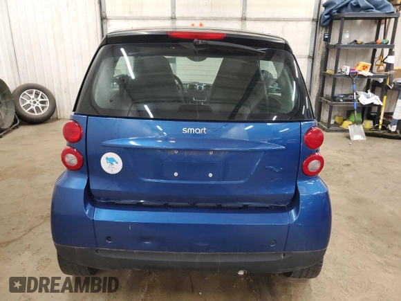 2009 Smart fortwo Pure z VIN WMEEJ31X99K209790, wystawiony jako Copart lot #51102685 z przebiegiem 30 389 mil mil oraz Szkody całkowita. Historia ofert i sprzedaży dostępna na DreamBid. Obrazek 10.