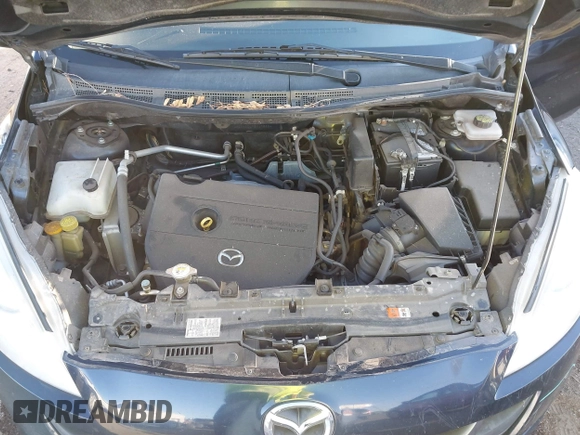 2014 Mazda 5 Grand Touring z VIN JM1CW2DL7E0175624, wystawiony jako IAAI lot #41469852 z przebiegiem 118 698 mil mil oraz . Historia ofert i sprzedaży dostępna na DreamBid. Obrazek 10.