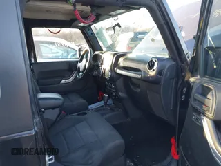 2011 Jeep Wrangler Rubicon with VIN 1J4HA6D11BL564211, listed as a IAAI auction lot 41242240 with 124,039 mi miles and . Bid and sale history available at carsss.com. Image 5.