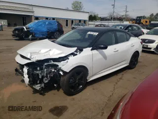 2024 Nissan Sentra SR z VIN 3N1AB8DV3RY242936, wystawiony jako Copart lot #54215815 z przebiegiem 5 228 mil mil oraz Szkoda całkowita • Salvage title. Historia ofert i sprzedaży dostępna na DreamBid. Obrazek 1.