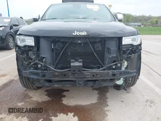2015 Jeep Grand Cherokee Summit z VIN 1C4RJFJT0FC674494, wystawiony jako IAAI lot #42056835 z przebiegiem 143 969 mil mil oraz . Historia ofert i sprzedaży dostępna na DreamBid. Obrazek 6.