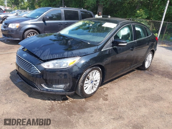 2018 Ford Focus Titanium with VIN 1FADP3J22JL220986, listed as a IAAI auction lot 42410253 with 40,791 mi miles and . Bid and sale history available at DreamBid. Image 17.