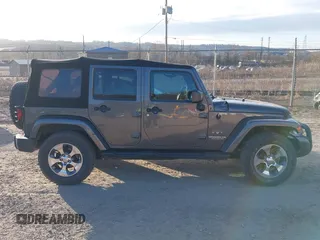 2017 Jeep Wrangler Unlimited Sahara with VIN 1C4BJWEG9HL507908, listed as a IAAI auction lot 41880209 with 99,773 mi miles. Bid and sale history available at carsss.com. Image 13.
