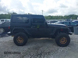 2012 Jeep Wrangler Sport z VIN 1C4AJWAG2CL286680, wystawiony jako IAAI lot #42434411 z przebiegiem 97 142 mil mil oraz . Historia ofert i sprzedaży dostępna na DreamBid. Obrazek 13.