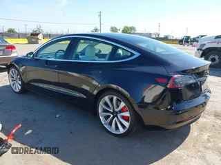 2019 Tesla Model 3 Long Range with VIN 5YJ3E1EB9KF231742, listed as a IAAI auction lot 42114608 with 86,657 mi miles and . Bid and sale history available at DreamBid. Image 3.