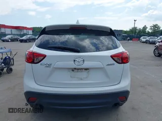 2014 Mazda CX-5 Touring z VIN JM3KE4CY9E0373359, wystawiony jako IAAI lot #42209277 z przebiegiem 106 493 mil mil oraz . Historia ofert i sprzedaży dostępna na DreamBid. Obrazek 17.
