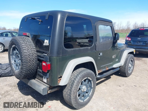 2006 Jeep Wrangler SE with VIN 1J4FA29116P763914, listed as a IAAI auction lot 42140140 with 107,161 mi miles. Bid and sale history available at carsss.com. Image 4.