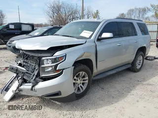 2015 Chevrolet Tahoe LT with VIN 1GNSCBKC4FR552034, listed as a IAAI auction lot 41891302 with 145,969 mi miles and . Bid and sale history available at DreamBid. Image 2.