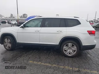 2019 Volkswagen Atlas SE z VIN 1V2WR2CA8KC504134, wystawiony jako IAAI lot #41700050 z przebiegiem 97 047 mil mil oraz . Historia ofert i sprzedaży dostępna na DreamBid. Obrazek 14.