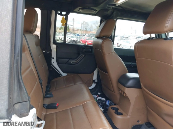 2012 Jeep Wrangler Unlimited Sahara with VIN 1C4BJWEG9CL220965, listed as a IAAI auction lot 41902295 with 120,492 mi miles. Bid and sale history available at carsss.com. Image 8.