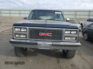 1989 GMC Suburban z VIN 1GKGV26K0KF517730, wystawiony jako Copart lot #41437715 z przebiegiem 21 423 mil mil oraz Szkody całkowita. Historia ofert i sprzedaży dostępna na DreamBid. Obrazek 5.