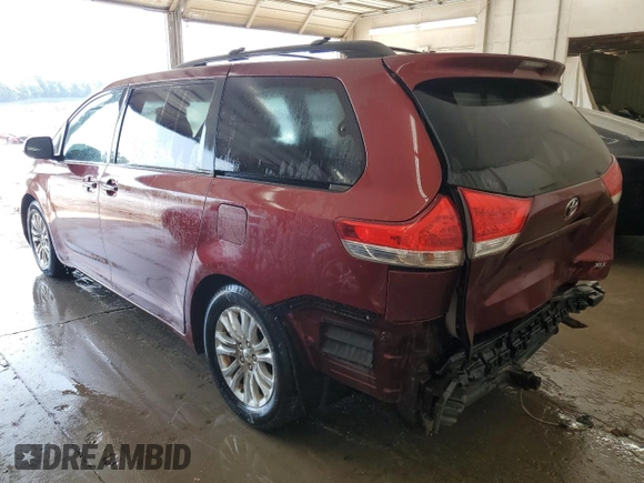2011 Toyota Sienna XLE AAS with VIN 5TDYK3DC8BS024209, listed as a Copart auction lot 58923715 with 134,051 mi miles and Salvage title. Bid and sale history available at DreamBid. Image 2.