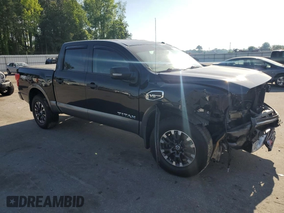 2017 Nissan Titan Platinum Reserve with VIN 1N6AA1E53HN569660, listed as a Copart auction lot 54409625 with 98,858 mi miles and Salvage title. Bid and sale history available at DreamBid. Image 4.