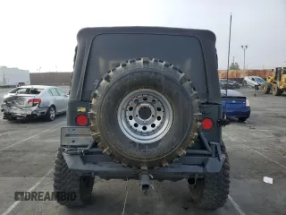 2002 Jeep Wrangler Sahara with VIN 1J4FA59S42P742978, listed as a Copart auction lot 46707685 with 77,272 mi miles and Salvage Title. Bid and sale history available at carsss.com. Image 6.