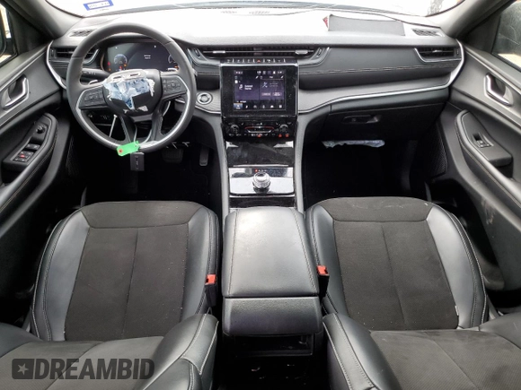 2023 Jeep Grand Cherokee Altitude with VIN 1C4RJGAG7PC573429, listed as a Copart auction lot 58052174 with 9,704 mi miles and Salvage title. Bid and sale history available at DreamBid. Image 8.