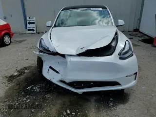 2025 Tesla Model Y Long Range with VIN 7SAYGDED4SF232433, listed as a Copart auction lot 51504015 with Not Provided miles and Salvage Title. Bid and sale history available at DreamBid. Image 15.