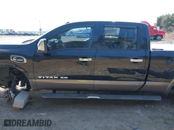 2016 Nissan Titan XD Platinum Reserve with VIN 1N6BA1F27GN506410, listed as a IAAI auction lot 41768621 with 159,404 mi miles. Bid and sale history available at carsss.com. Image 15.
