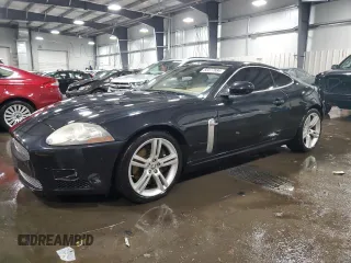 2007 Jaguar XK with VIN SAJWA43C479B18700, listed as a Copart auction lot 83377684 with 143,746 mi miles and Salvage Title. Bid and sale history available at carsss.com. Image 1.