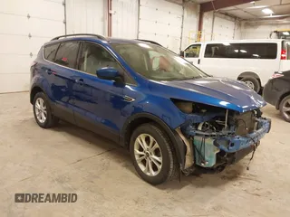 2018 Ford Escape SE with VIN 1FMCU9GD4JUA83470, listed as a IAAI auction lot 41272882 with 105,661 mi miles. Bid and sale history available at carsss.com. Image 1.
