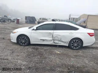 2016 Toyota Avalon Limited with VIN 4T1BK1EB8GU234565, listed as a IAAI auction lot 41804701 with 128,700 mi miles. Bid and sale history available at carsss.com. Image 14.