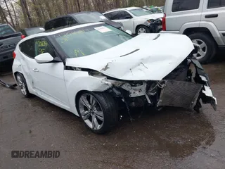 2012 Hyundai Veloster w/Gray Int z VIN KMHTC6AD3CU060811, wystawiony jako IAAI lot #42016391 z przebiegiem 179 309 mil mil oraz . Historia ofert i sprzedaży dostępna na DreamBid. Obrazek 1.