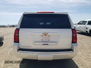 2015 Chevrolet Suburban LTZ with VIN 1GNSKKKC1FR659707, listed as a Copart auction lot 50202895 with 91,680 mi miles and Salvage Title. Bid and sale history available at DreamBid. Image 6.