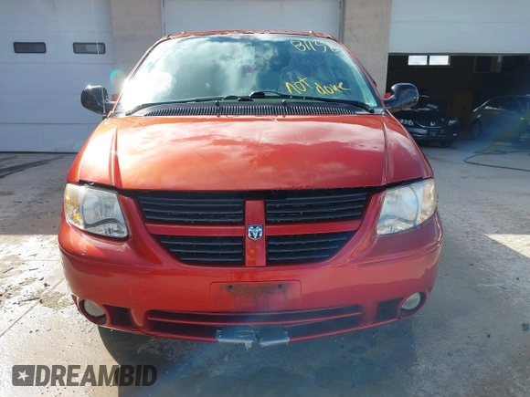 2005 Dodge Grand Caravan with VIN 2D4G944L75R310409, listed as a IAAI auction lot 41781132 with 128,120 mi miles and . Bid and sale history available at DreamBid. Image 12.