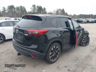 2016 Mazda CX-5 Grand Touring with VIN JM3KE4DY1G0685449, listed as a IAAI auction lot 41162840 with 134,525 mi miles. Bid and sale history available at carsss.com. Image 4.
