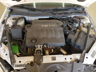 2012 Chevrolet Impala LTZ with VIN 2G1WC5E3XC1102909, listed as a Copart auction lot 52786605 with 185,134 mi miles and Salvage Title. Bid and sale history available at DreamBid. Image 11.