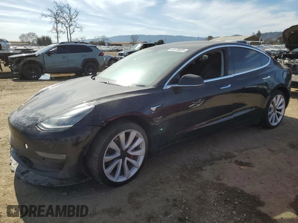2019 Tesla Model 3 Mid Range with VIN 5YJ3E1EAXKF311719, listed as a Copart auction lot 44570825 with 143,034 mi miles and Salvage Title. Bid and sale history available at carsss.com. Image 1.