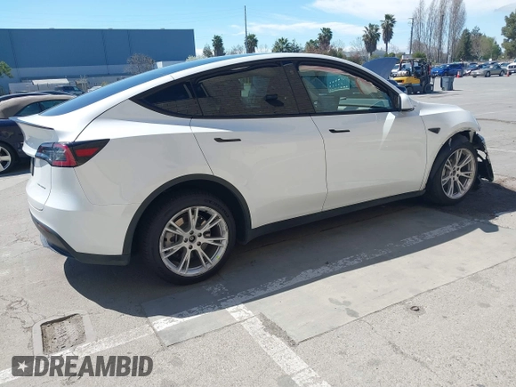 2023 Tesla Model Y Long Range with VIN 7SAYGDEE2PF696336, listed as a IAAI auction lot 41894686 with 34,203 mi miles. Bid and sale history available at carsss.com. Image 4.