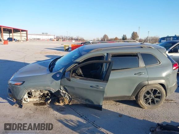 2015 Jeep Cherokee Trailhawk with VIN 1C4PJMBSXFW614416, listed as a IAAI auction lot 41033241 with 112,015 mi miles. Bid and sale history available at carsss.com. Image 15.