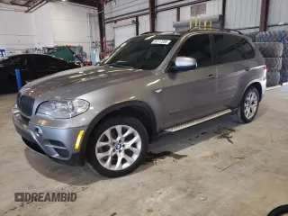 2012 BMW X5 35i with VIN 5UXZV4C5XCL767234, listed as a Copart auction lot 64117285 with 187,969 mi miles and Clean title. Bid and sale history available at DreamBid. Image 1.