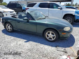 1999 Mazda MX-5 Miata with VIN JM1NB3530X0118452, listed as a Copart auction lot 53337575 with 150,574 mi miles and Clean title. Bid and sale history available at DreamBid. Image 4.