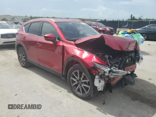 2018 Mazda CX-5 Grand Touring with VIN JM3KFADM4J1395832, listed as a Copart auction lot 66464915 with 41,410 mi miles and Salvage title. Bid and sale history available at DreamBid. Image 4.